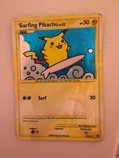 Surfing Pikachu 114/111 Rising Rivals Holo