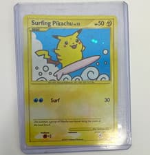 The Pokemon Company Surfing Pikachu 114/111 Rising Rivals Secret Rare Holo EN