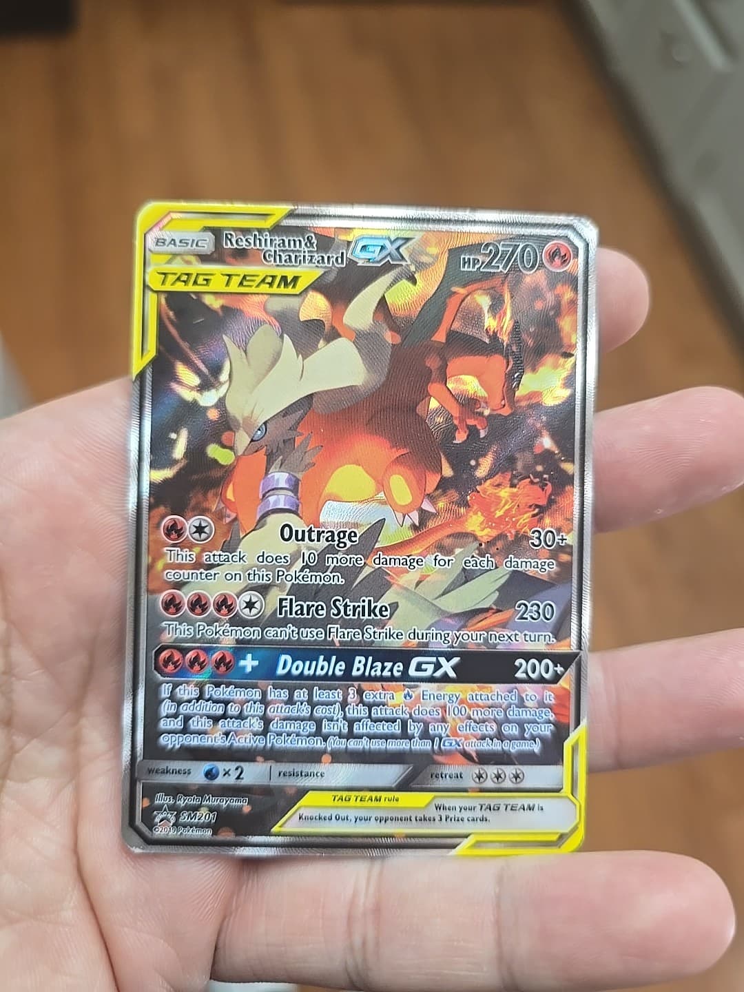 Reshiram and Charizard SM201 GX Tag Team Pokemon Card Moderately Played